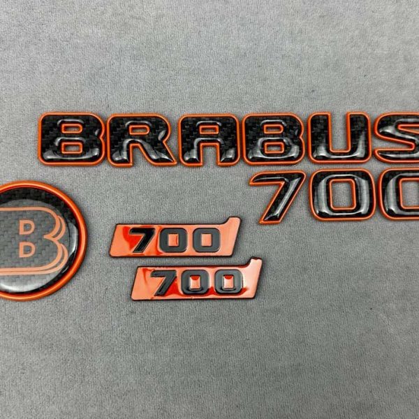 Brabus 700 Carbon badges set in orange color